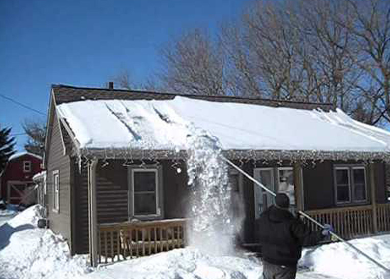 removing snow from the roof