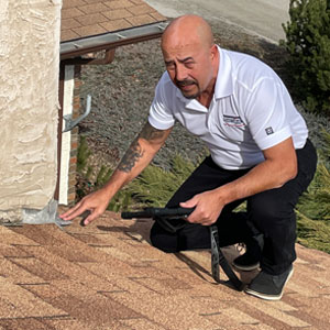 home inspector checking roof