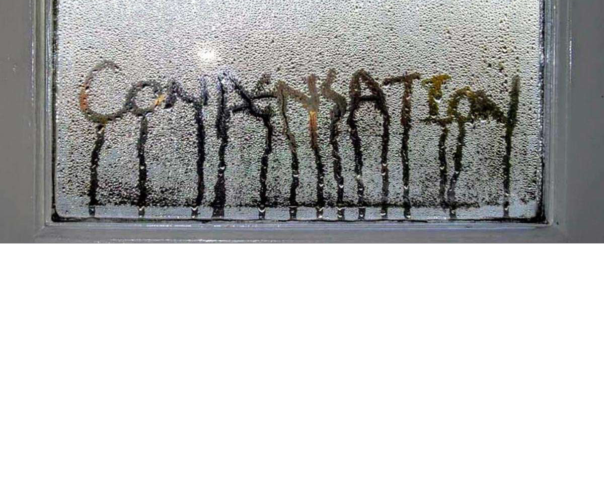 the word condensation written in the condensation on the window