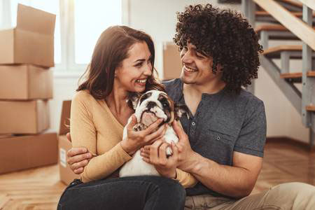 couple with cute puppy just moved in