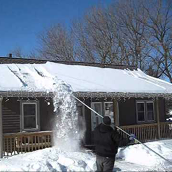 removing snow from roof with a roof rake