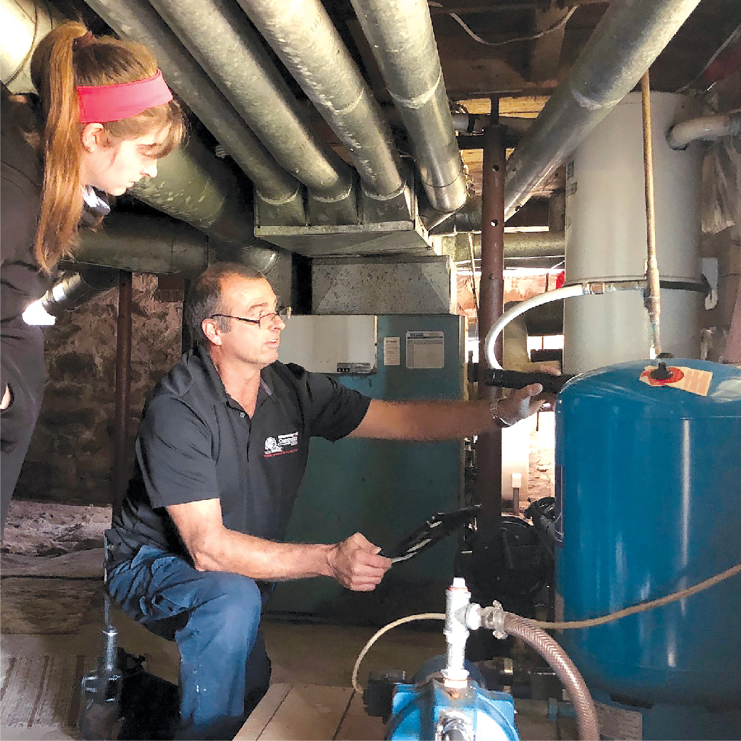 inspector with client in basement